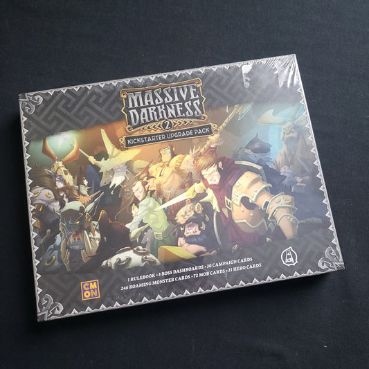 Image shows the front cover of the box of the Kickstarter Upgrade Pack for the board game Massive Darkness 2: Hellscape