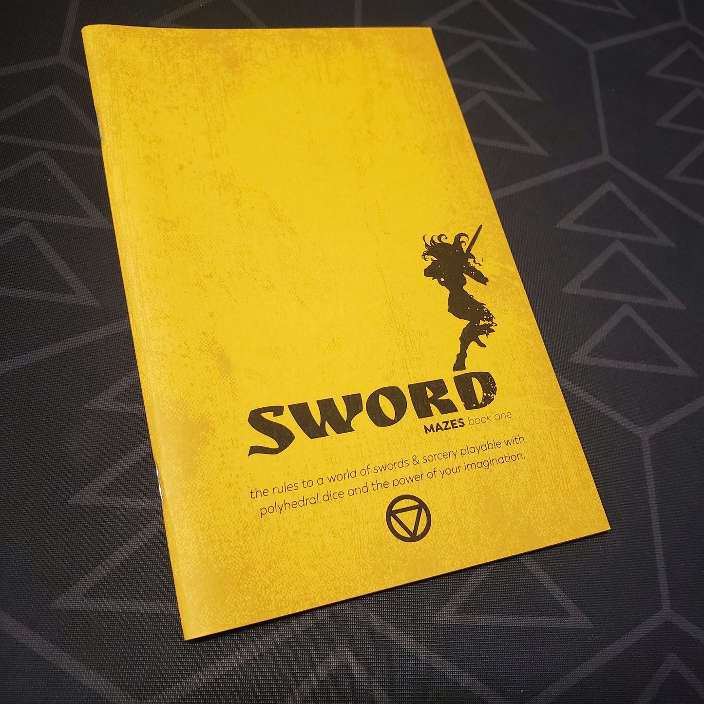 Image shows the front cover of the Book One: Sword zine for the roleplaying game Mazes