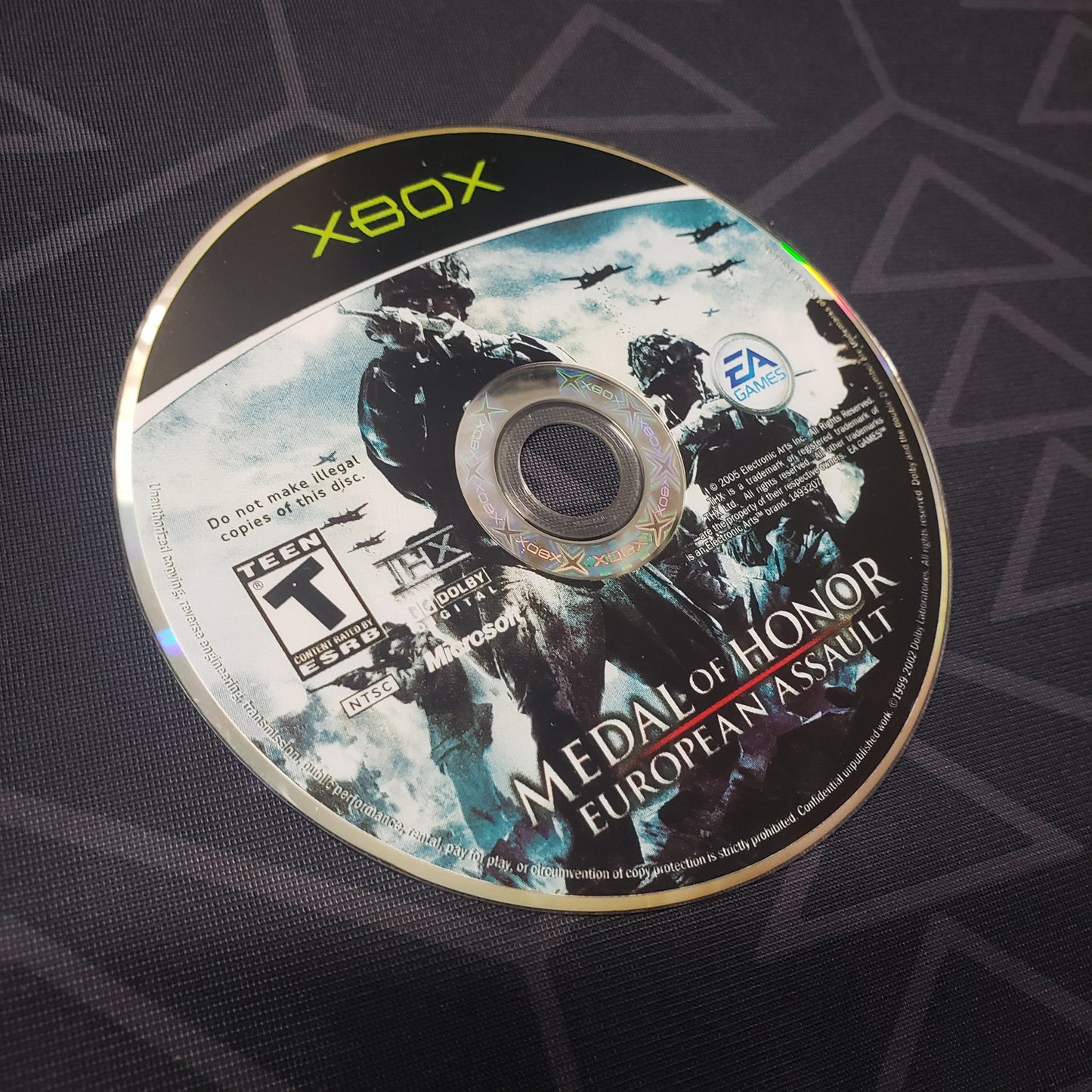 Image shows the label side of the game disc for the video game Medal of Honor: European Assault for the original Xbox