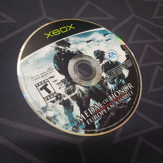 Image shows the label side of the game disc for the video game Medal of Honor: European Assault for the original Xbox