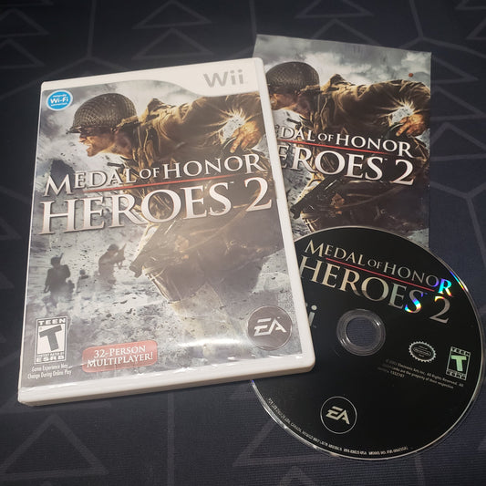 Image shows the case, manual and disc for the video game Medal of Honor: Heroes 2 for Nintendo Wii