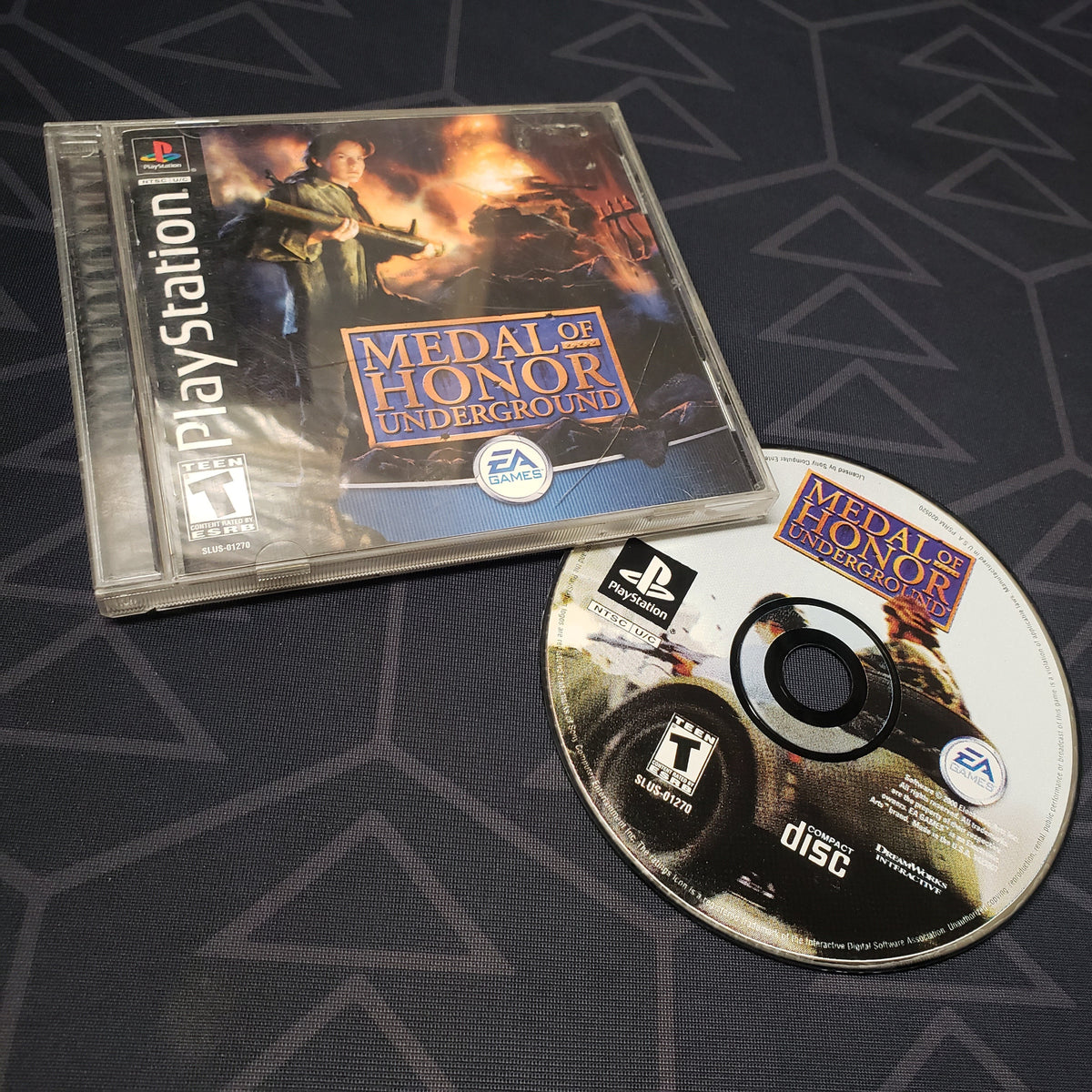 Image shows the jewel case with manual and disc for the video game Medal of Honor: Underground for Playstation 1