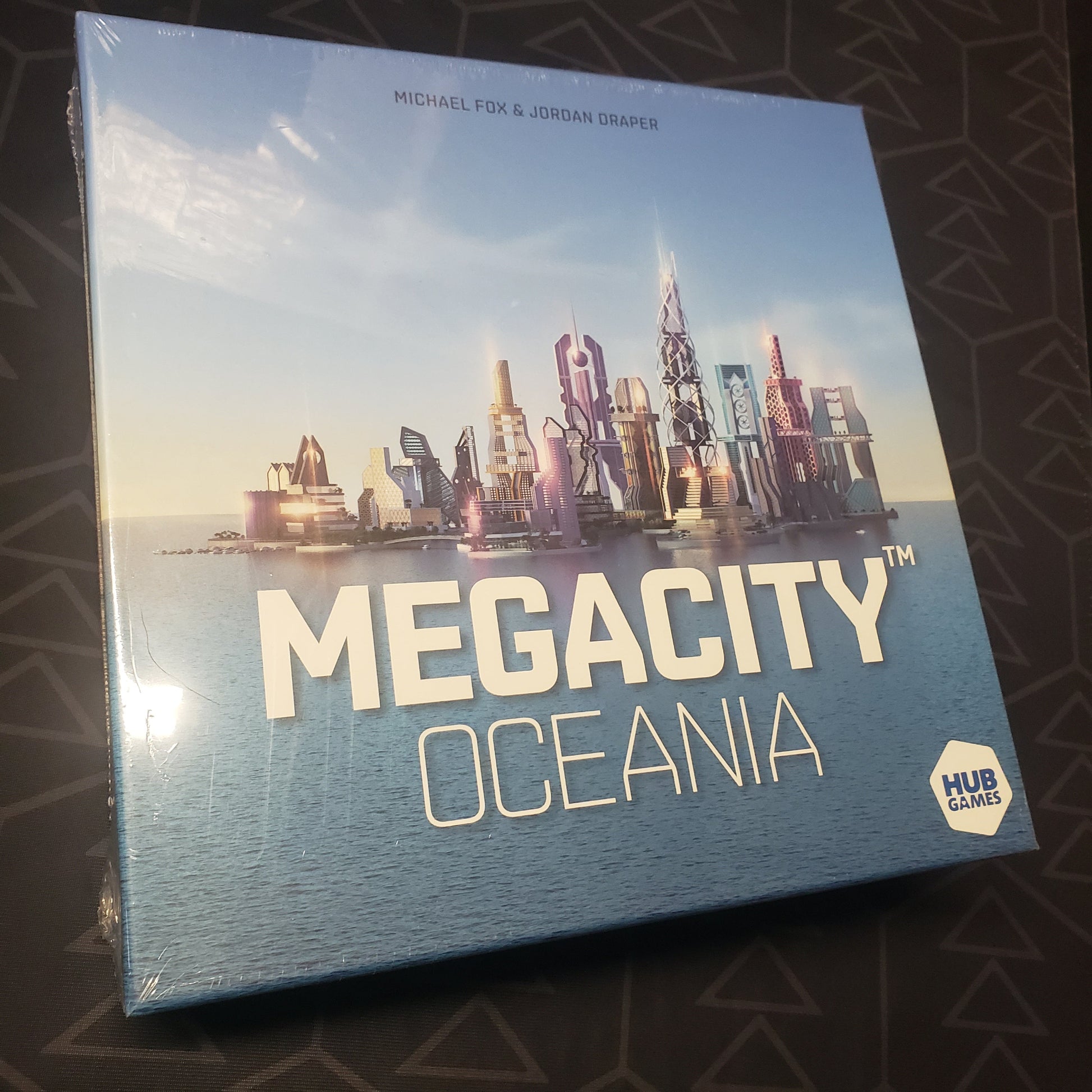 Image shows the front cover of the box for the MegaCity: Oceania board game