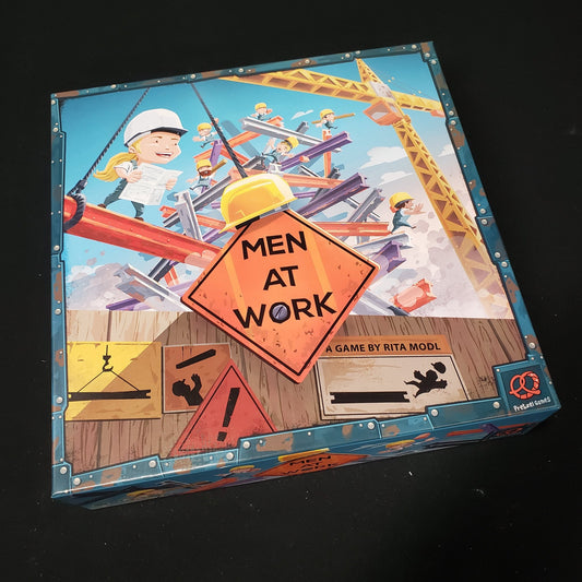 Image shows the front cover of the box of the Men At Aork board game