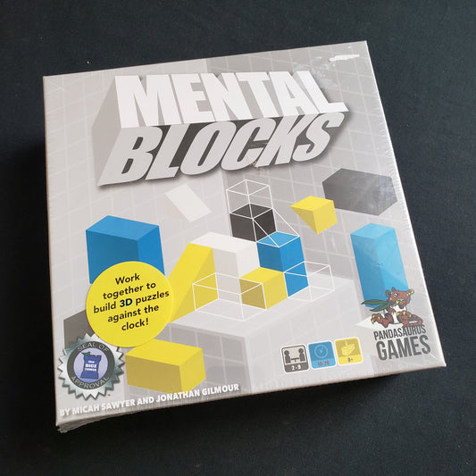 Image shows the front cover of the box of the Mental Blocks board game