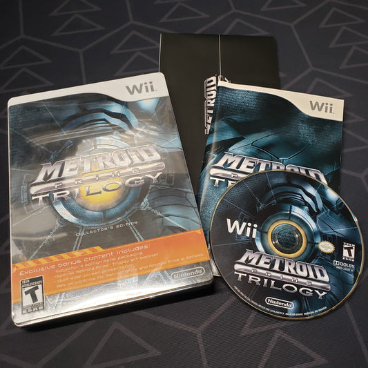 Image shows the case, manual and disc for the video game Metroid Prime Trilogy for Nintendo Wii