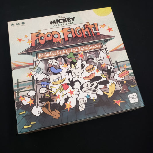 Image shows the front cover of the box of the Mickey and Friends: Food Fight board game