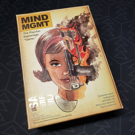Image shows the front cover of the box for the Mind MGMT board game