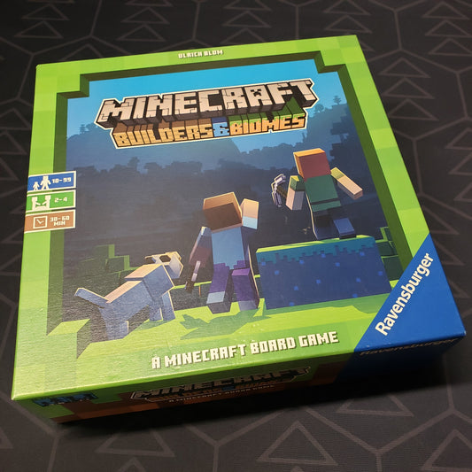 Image shows the front cover of the box for the Minecraft: Builders & Biomes board game