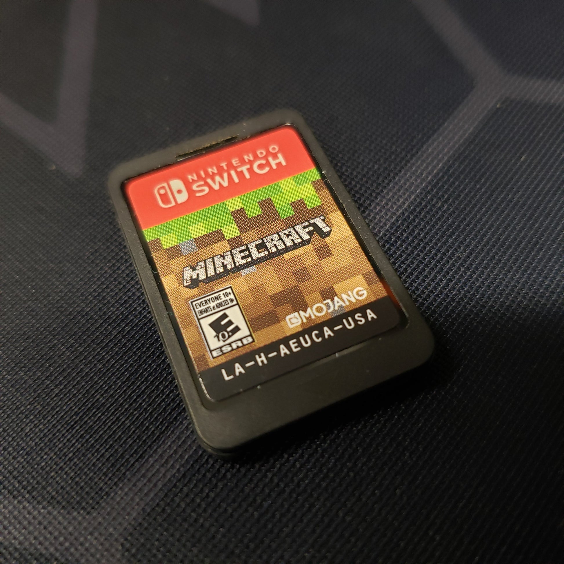 Image shows the cartridge for the game Minecraft for Nintendo Switch