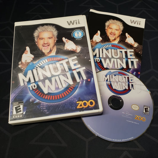 Image shows the case, manual and disc for the video game Minute to Win It for Nintendo Wii