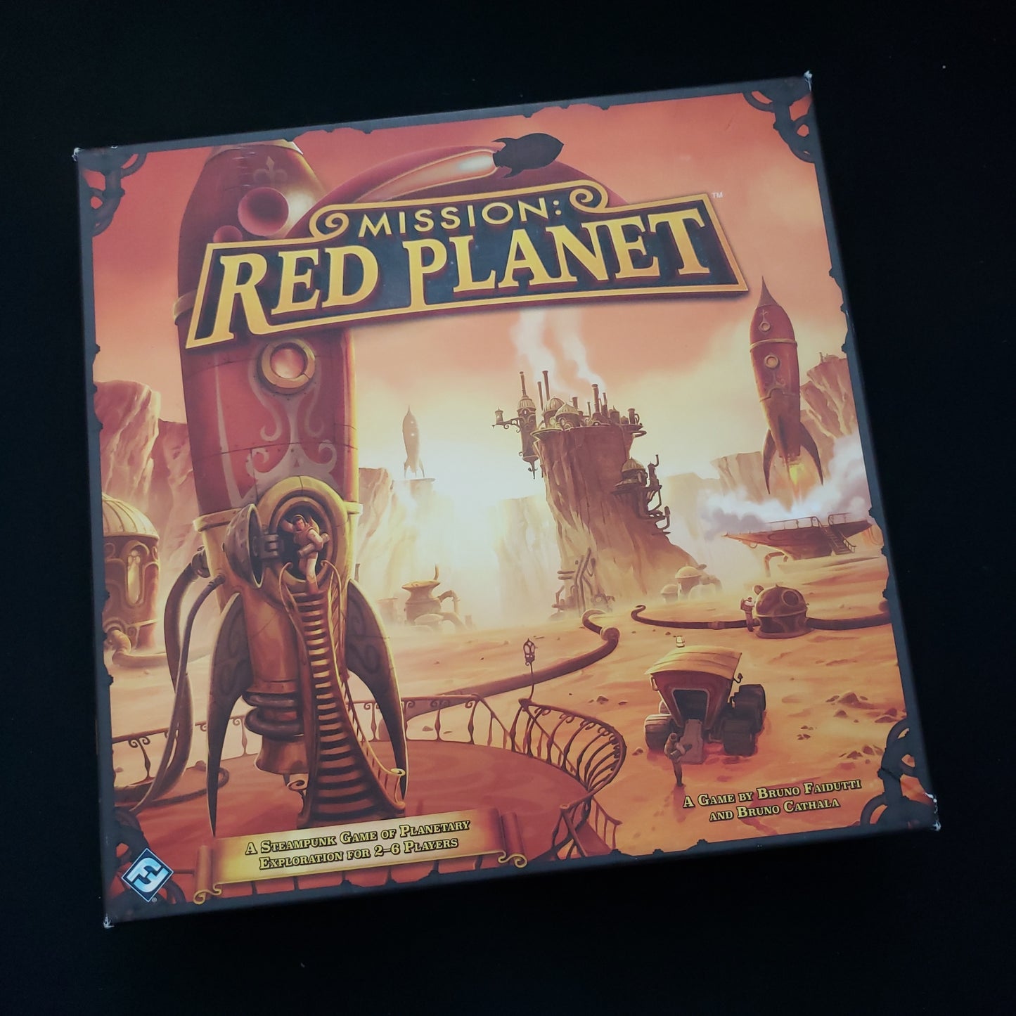 Image shows the front cover of the box of the Mission Red Planet board game