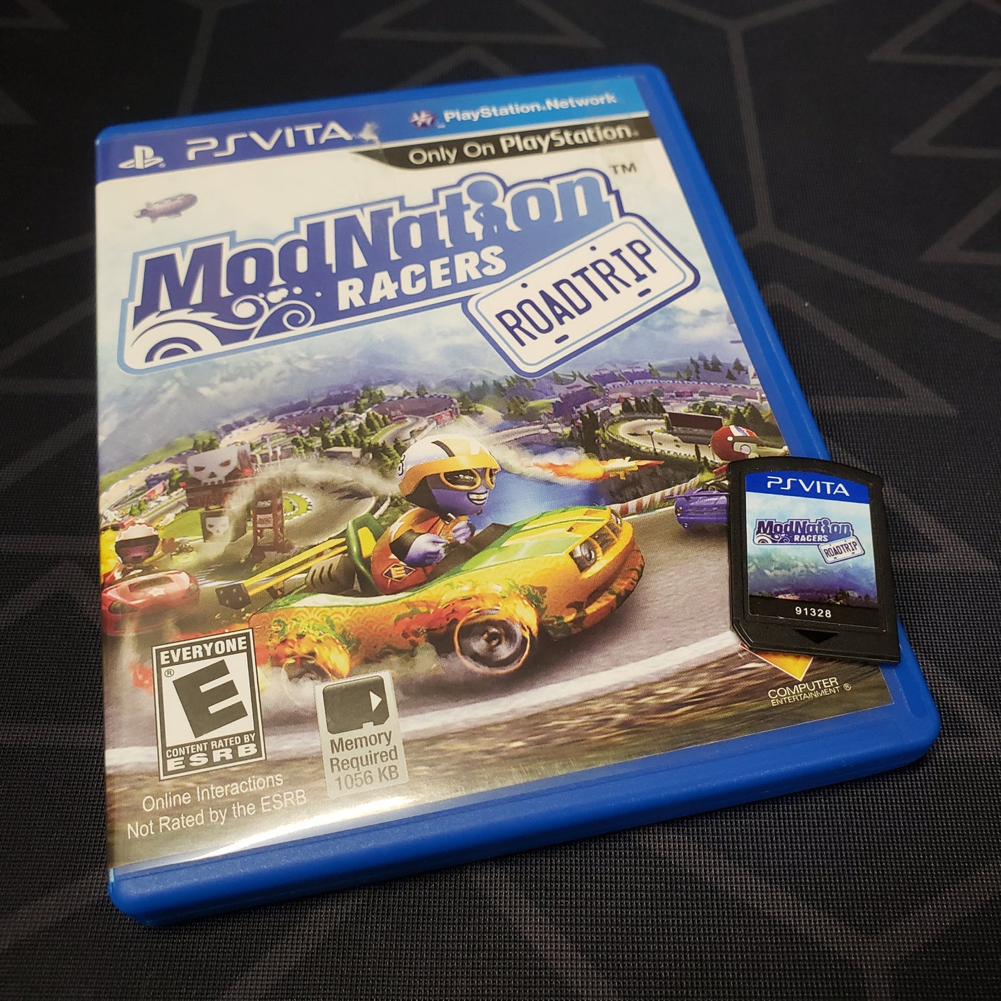 Image shows the case & cartridge for the game ModNation Racers: Roadtrip for Playstation Vita