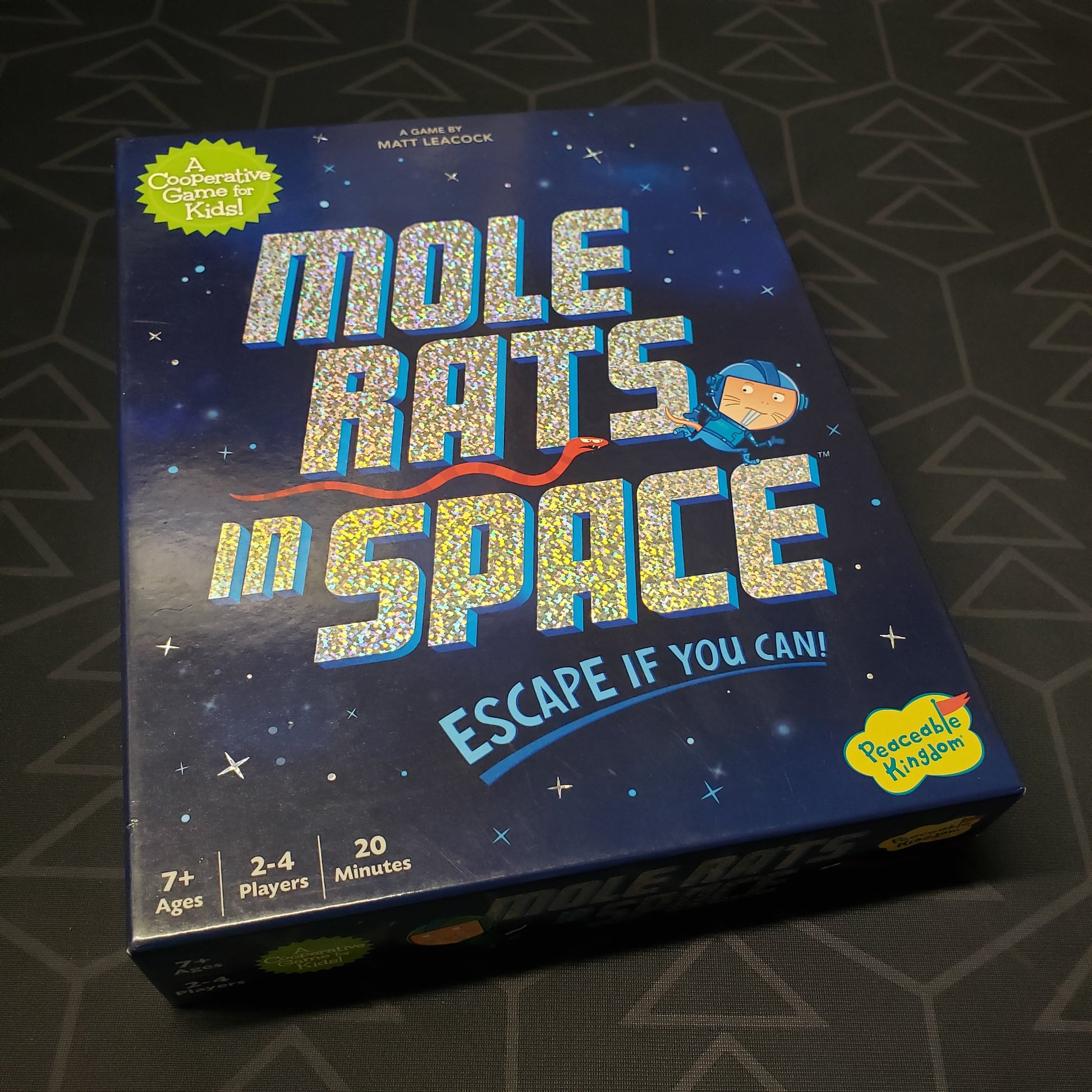 Image shows the front cover of the box for the Mole Rats in Space board game