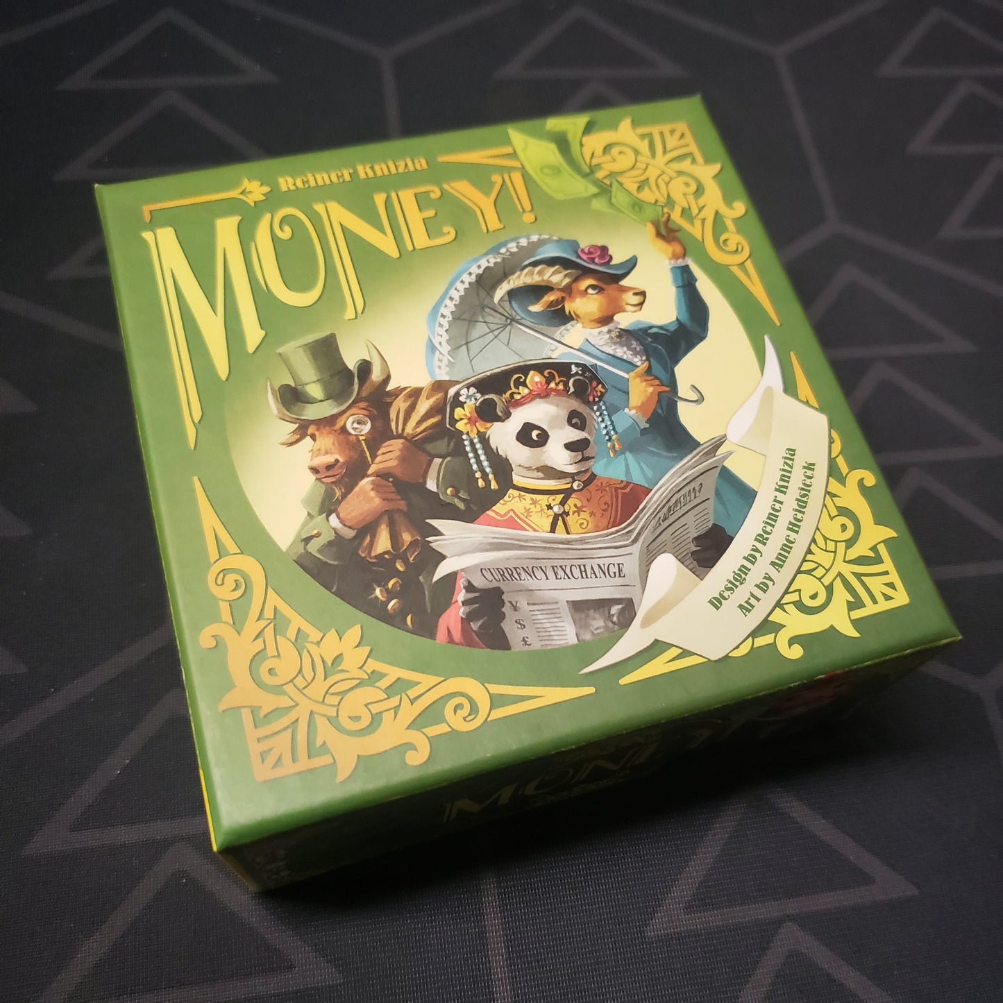 Image shows the front cover of the box for the Money! card game