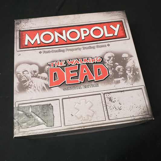 Image shows the front cover of the box of the board game Monopoly: The Walking Dead Survival Edition