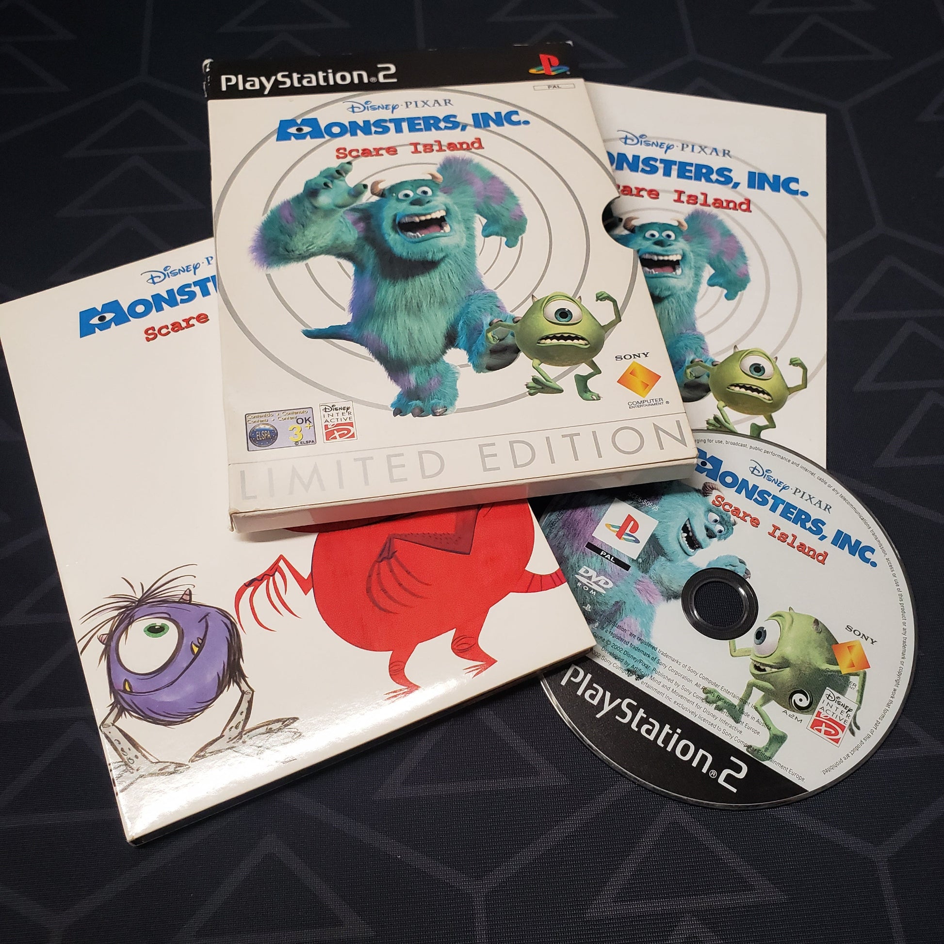 Image shows the case, manual, outer box and disc for the video game Monsters Inc.: Scare Island for Playstation 2