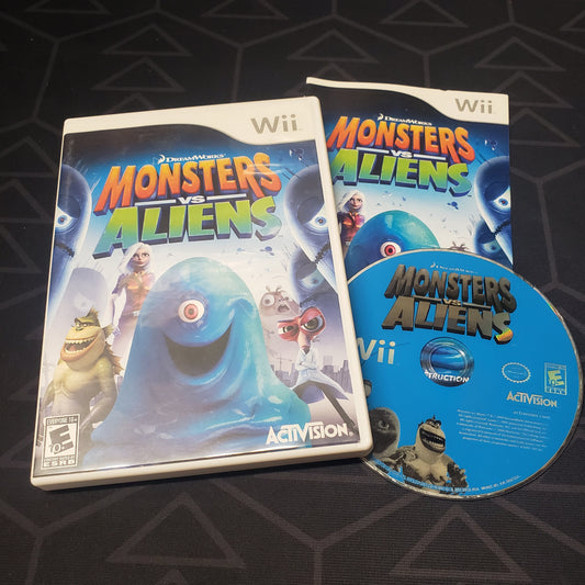Image shows the case, manual and disc for the video game Monsters vs Aliens for Nintendo Wii