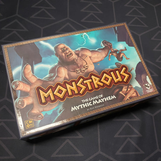 Image shows the front cover of the box for the Monstrous card game
