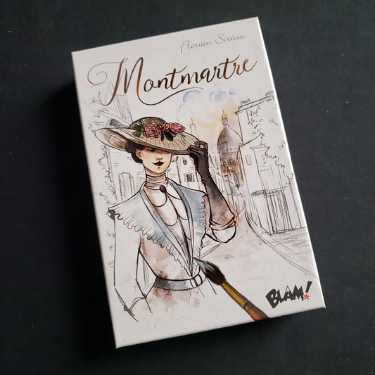 Image shows the front cover of the box of the Montmartre card game