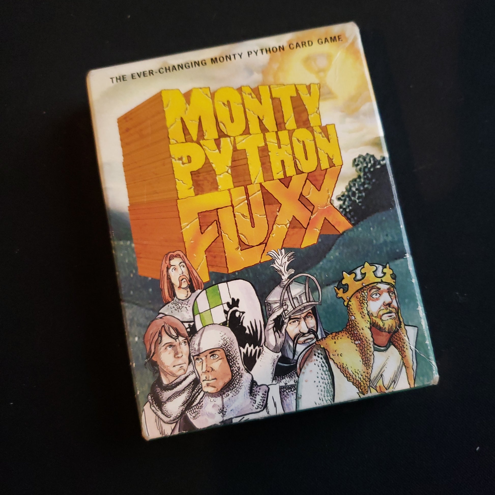 Image shows the front cover of the box of the Monty Python Fluxx card game