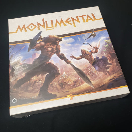 Image shows the front cover of the box of the Monumental board game