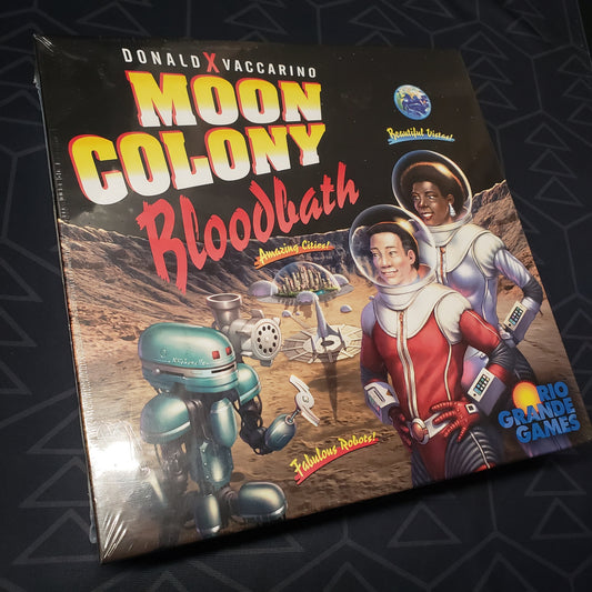 Image shows the front cover of the box for the Moon Colony Bloodbath board game