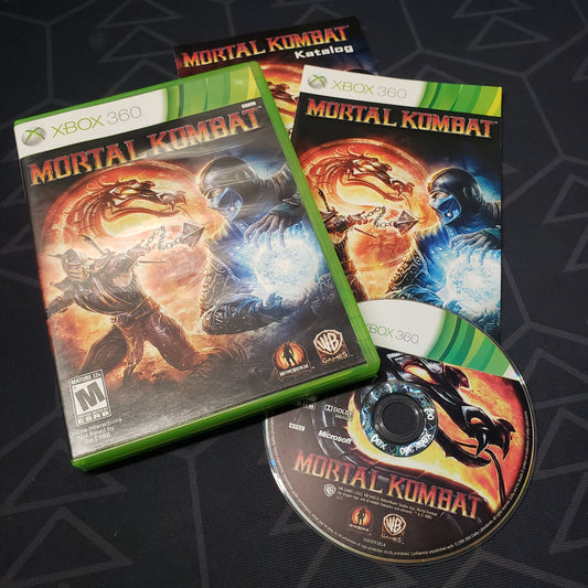 Image shows the case, manual and disc for the video game Mortal Kombat for Xbox 360