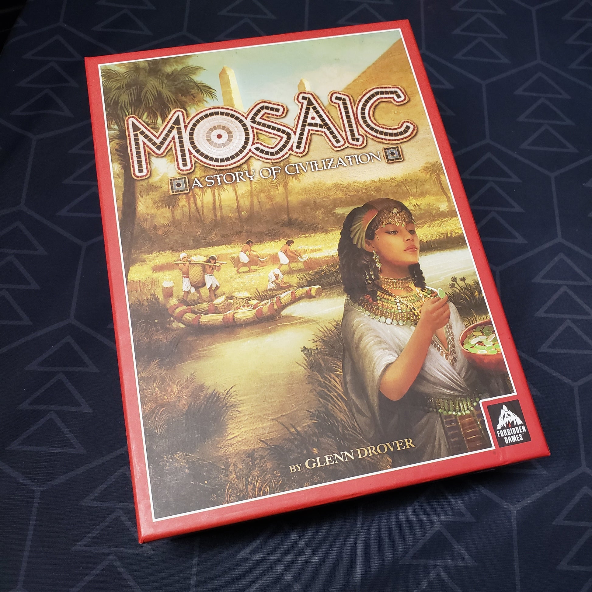 Image shows the front cover of the box for the board game Mosaic: A Story of Civilization