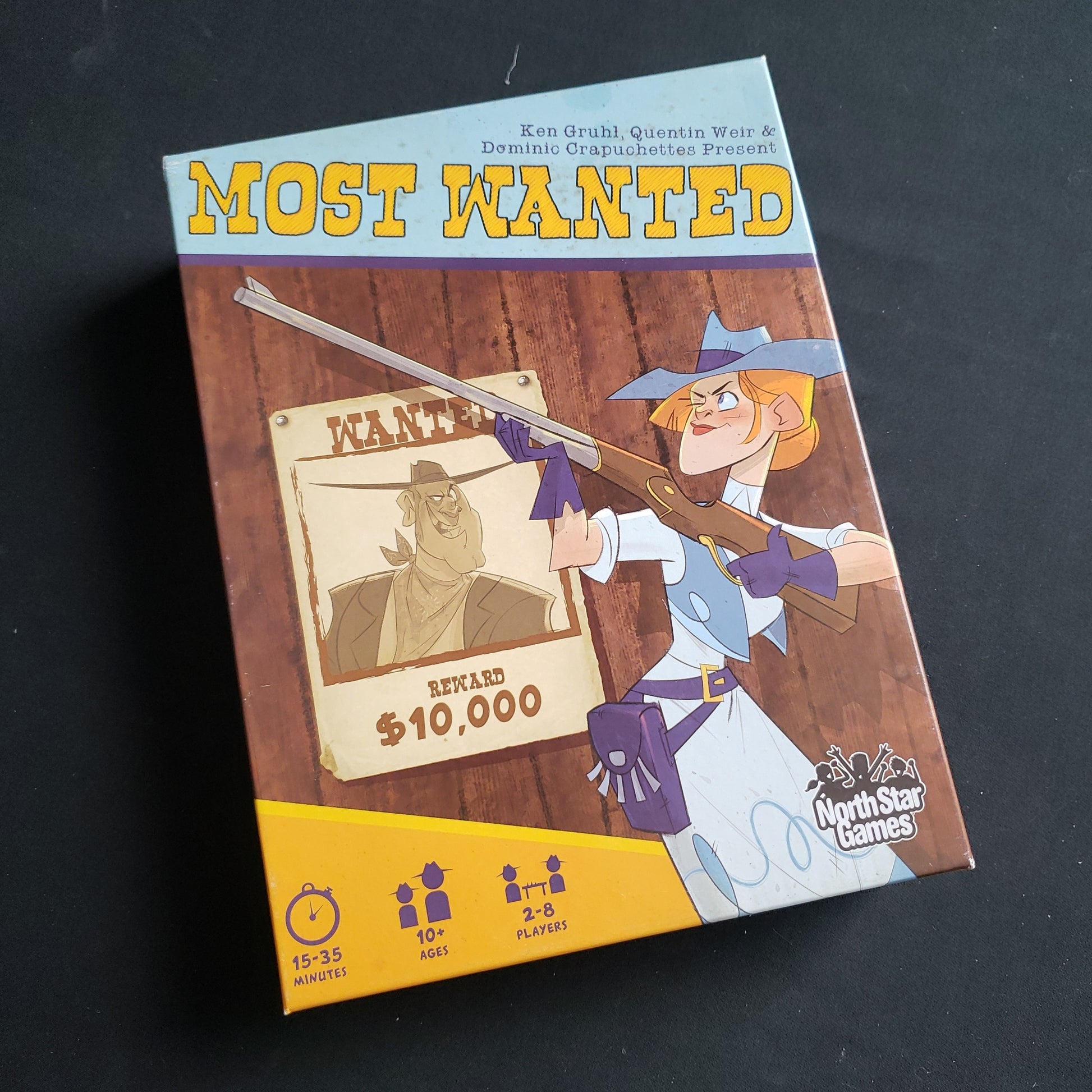Image shows the front cover of the box of the Most Wanted card game
