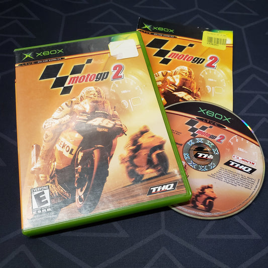 Image shows the case, manual and disc for the video game MotoGP 2 for the original Xbox