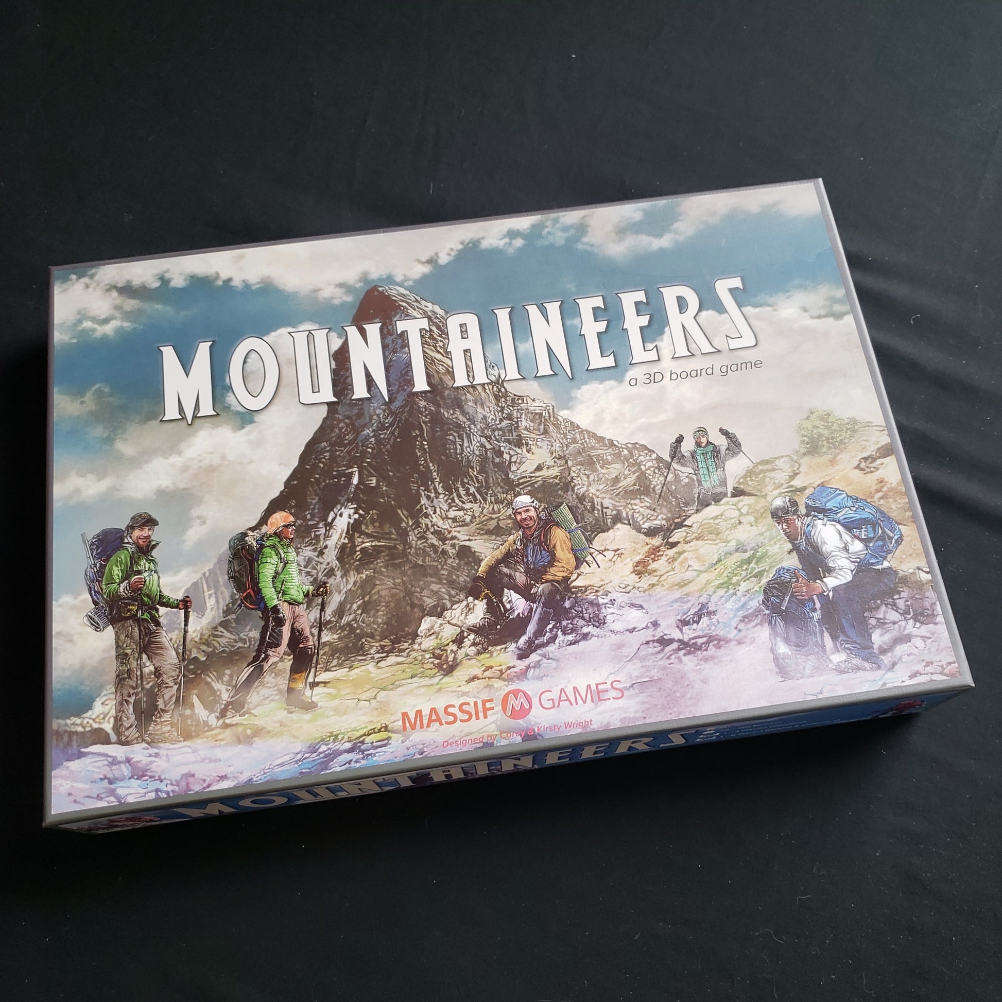 Image shows the front cover of the box of the Mountaineers board game