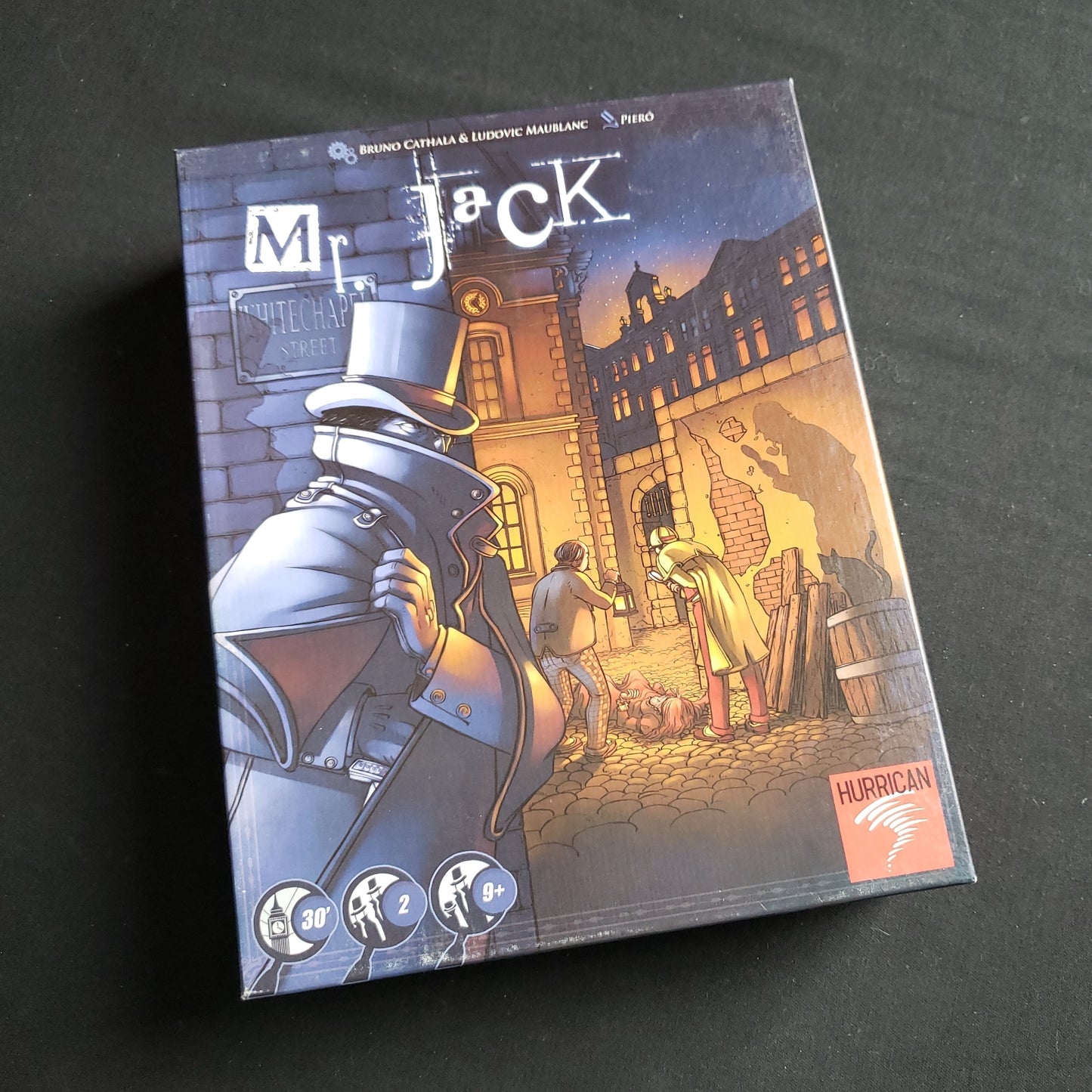 Image shows the front cover of the box of the Mr. Jack board game