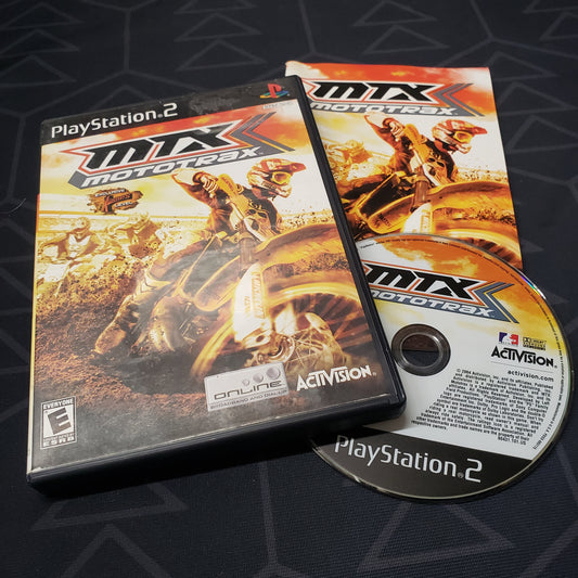 Image shows the case, manual and disc for the video game MTX: Mototrax for Playstation 2