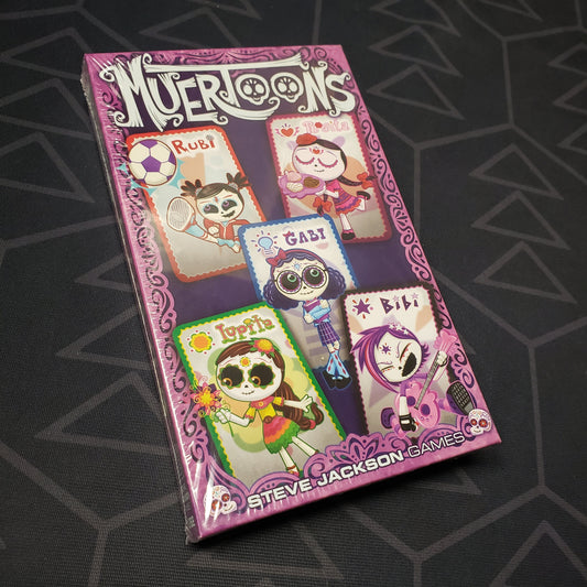 Image shows the front cover of the box for the Muertoons card game