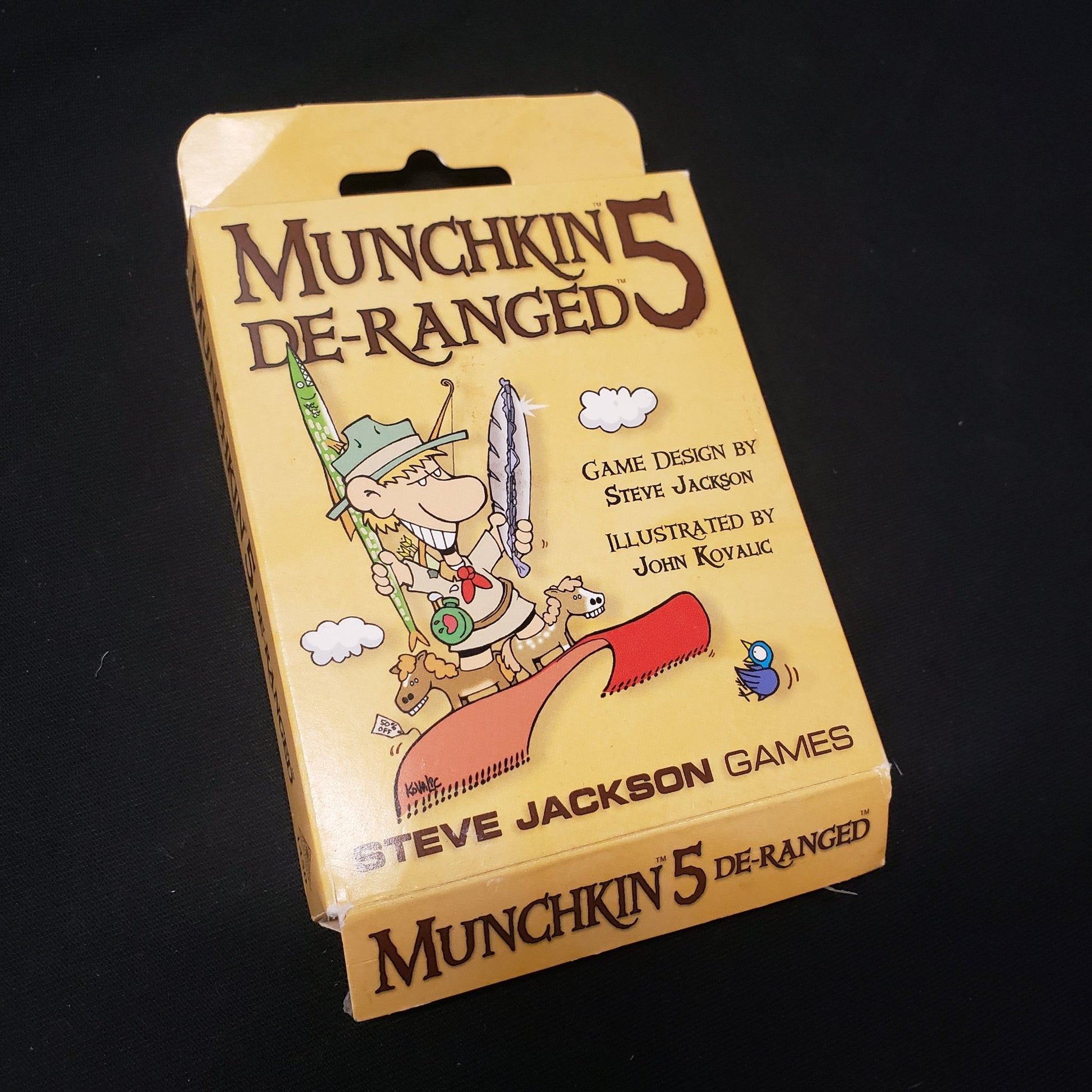 Image shows the front cover of the box of the De-Ranged expansion for the card game Munchkin