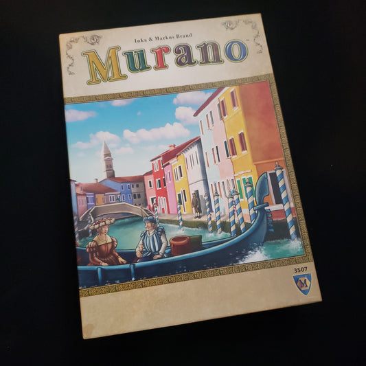 Image shows the front cover of the box of the Murano board game