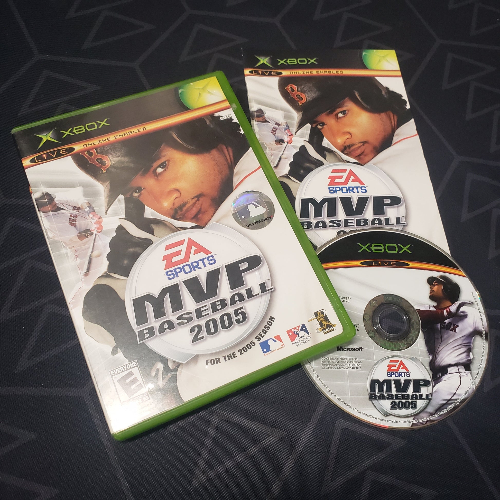 Image shows the case, manual and disc for the video game MVP Baseball 2005 for the original Xbox