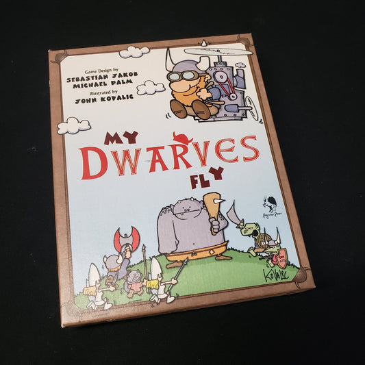 Image shows the front cover of the box of the My Dwarves Fly card game