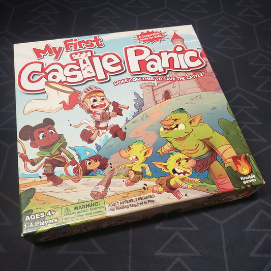 Image shows the front cover of the box for the board game My First Castle Panic