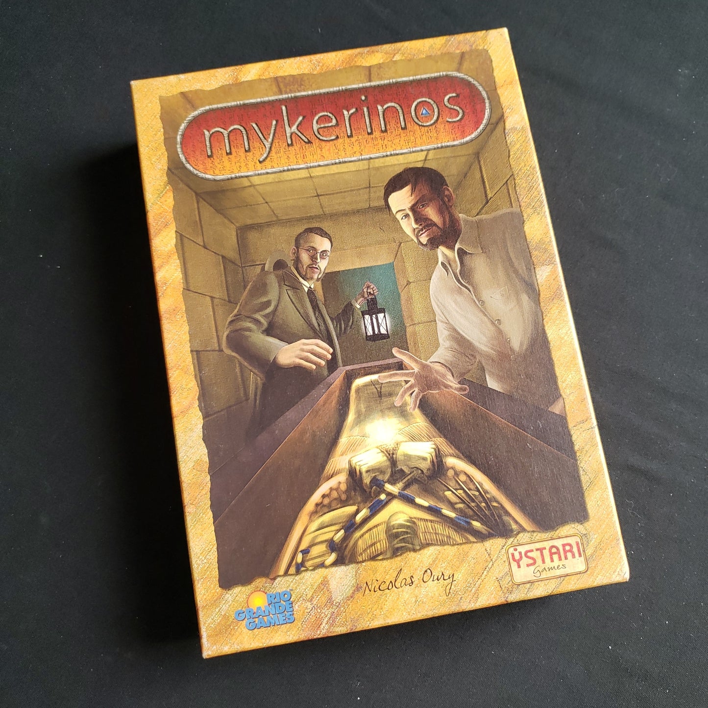 Image shows the front cover of the box of the Mykerinos board game