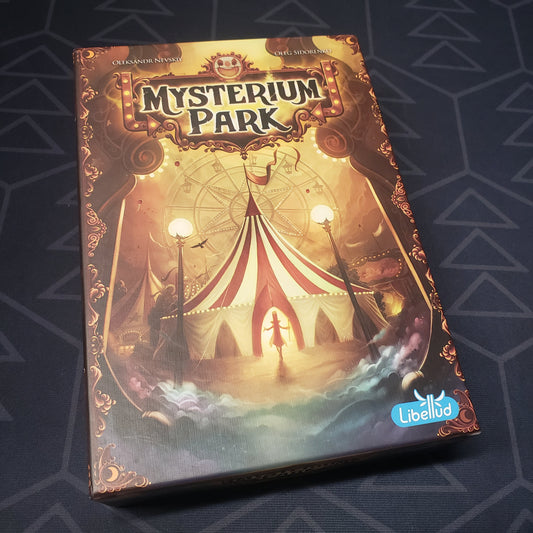 Image shows the front cover of the box for the Mysterium Park board game