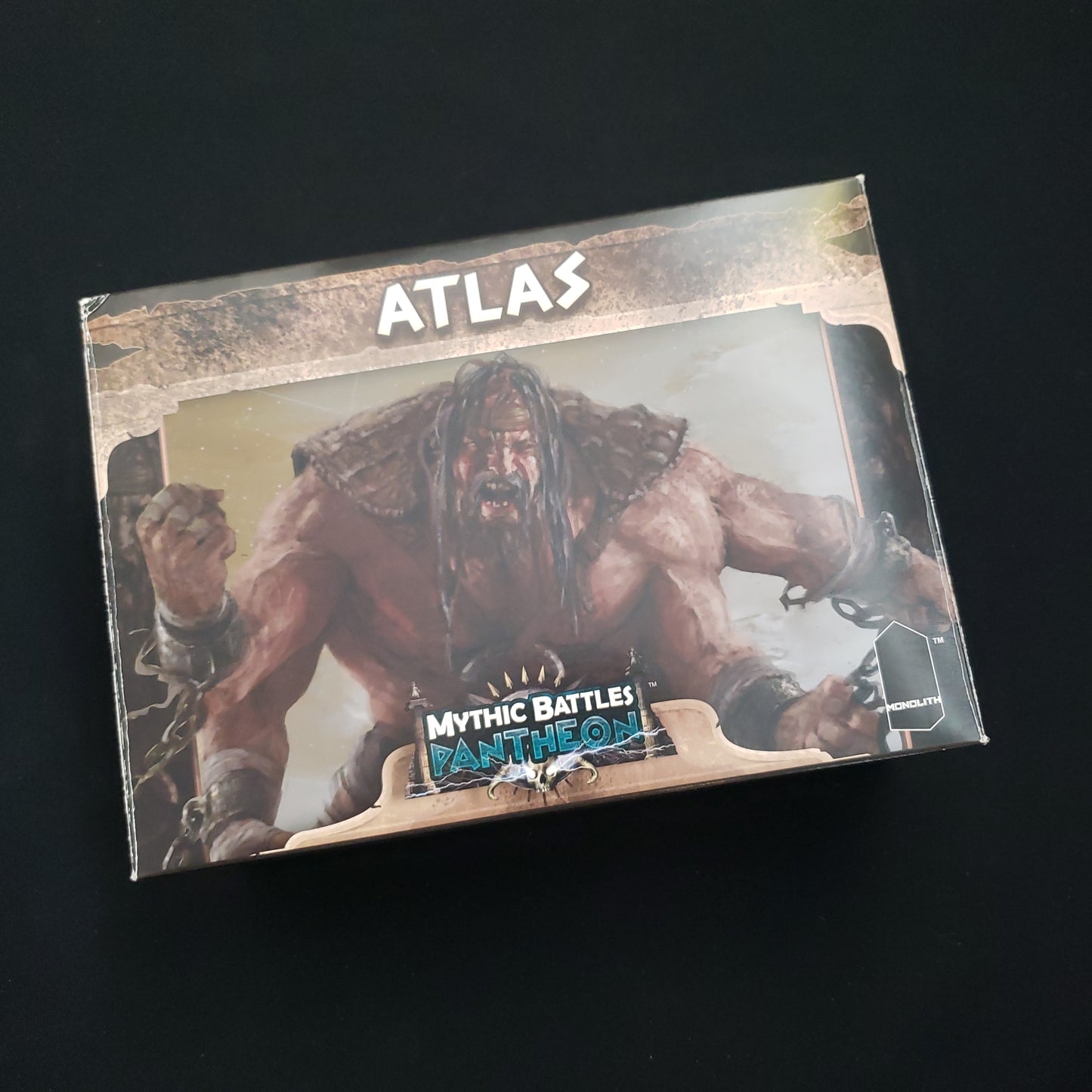 Image shows the front cover of the box of the Atlas expansion for the Mythic Battles Pantheon board game