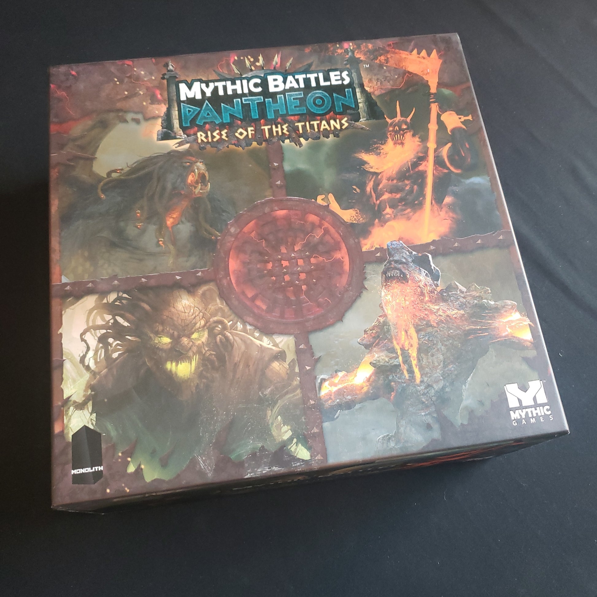 Image shows the front cover of the box of the Rise of the Titans expansion for the board game Mythic Battles Pantheon