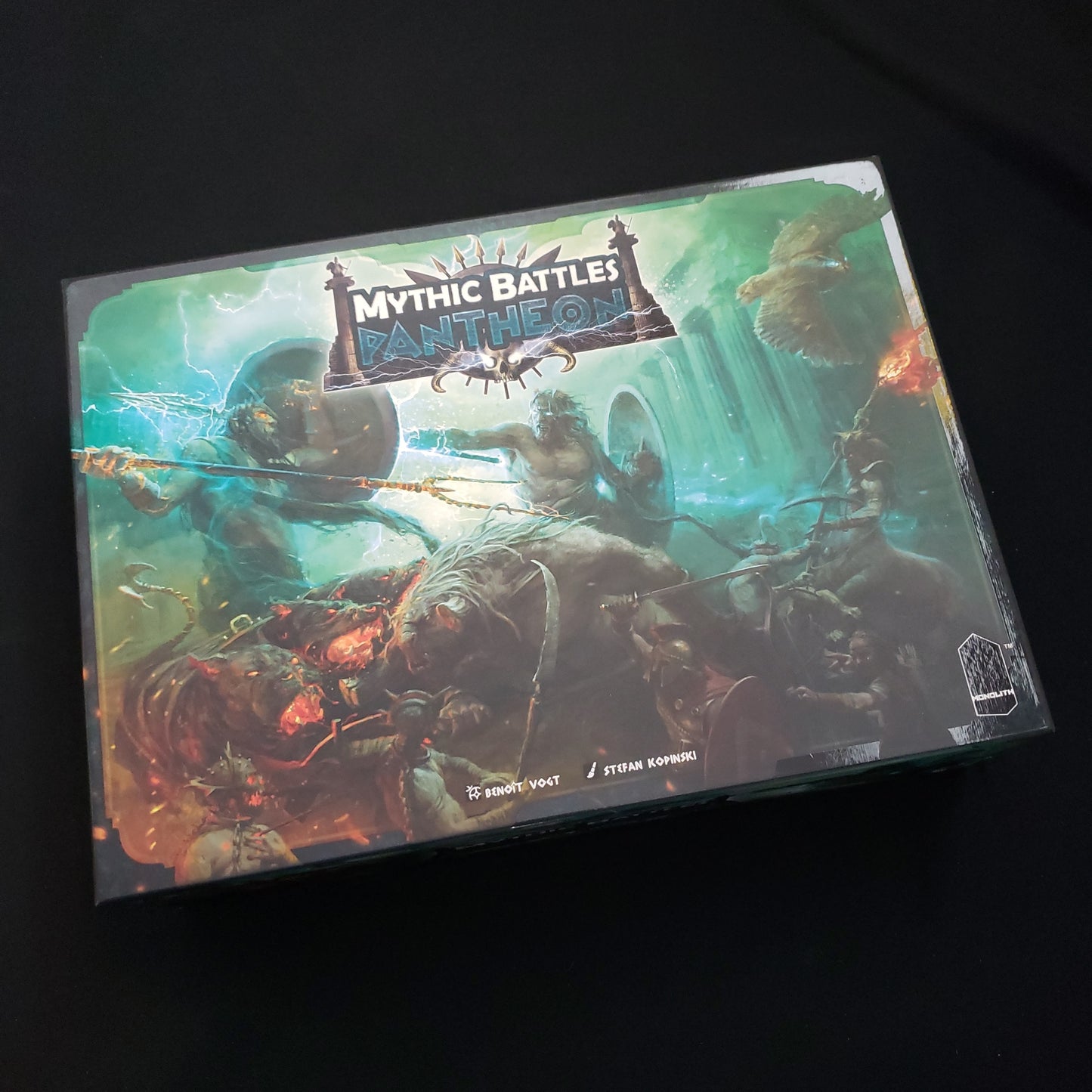 Image shows the front cover of the box of the Mythic Battles Pantheon board game
