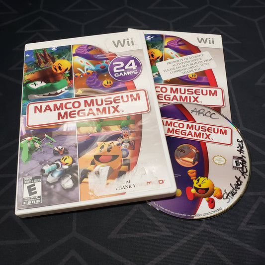 Image shows the case, manual and disc for the video game Namco Museum Megamix for Nintendo Wii