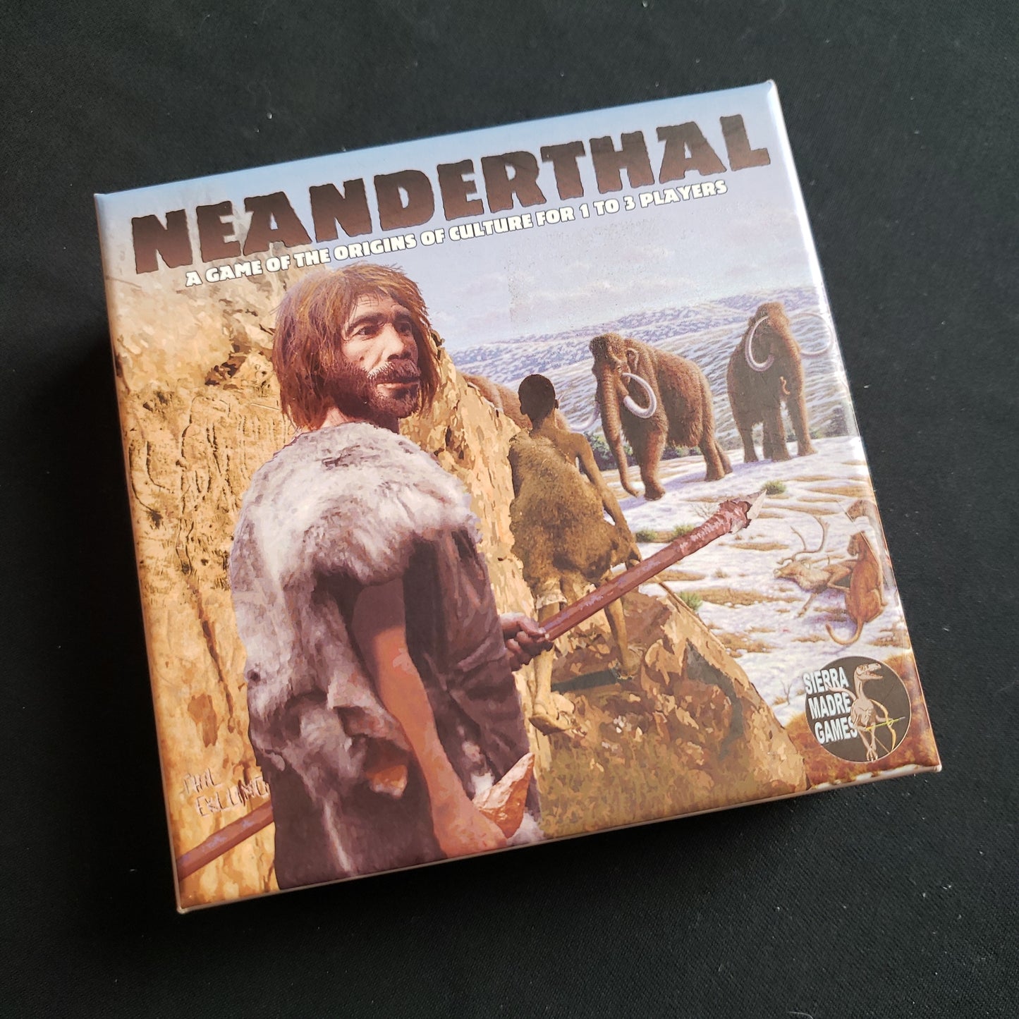 Image shows the front cover of the box of the Neanderthal card game