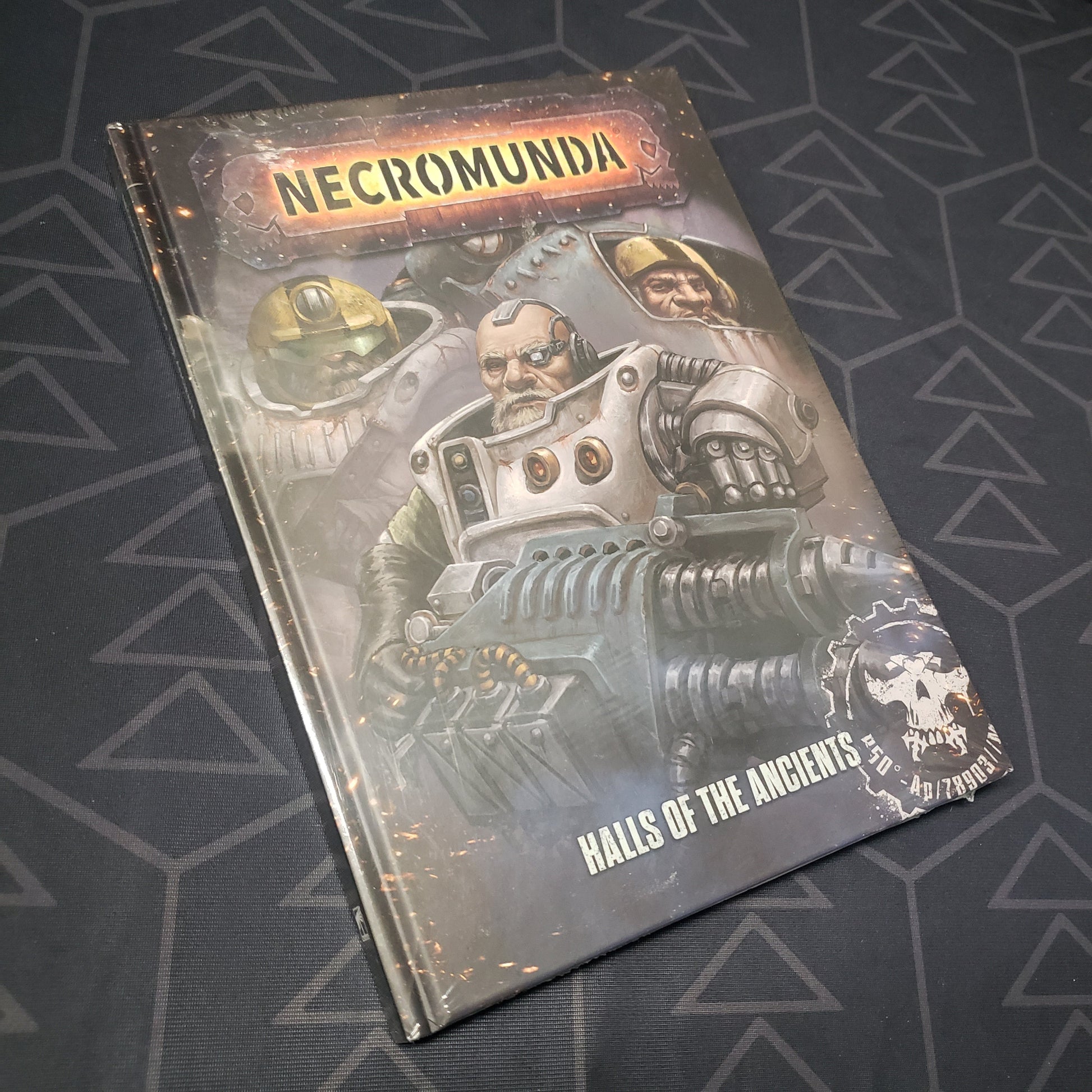 Image shows the front cover of the Necromunda: Halls of the Ancients wargaming book