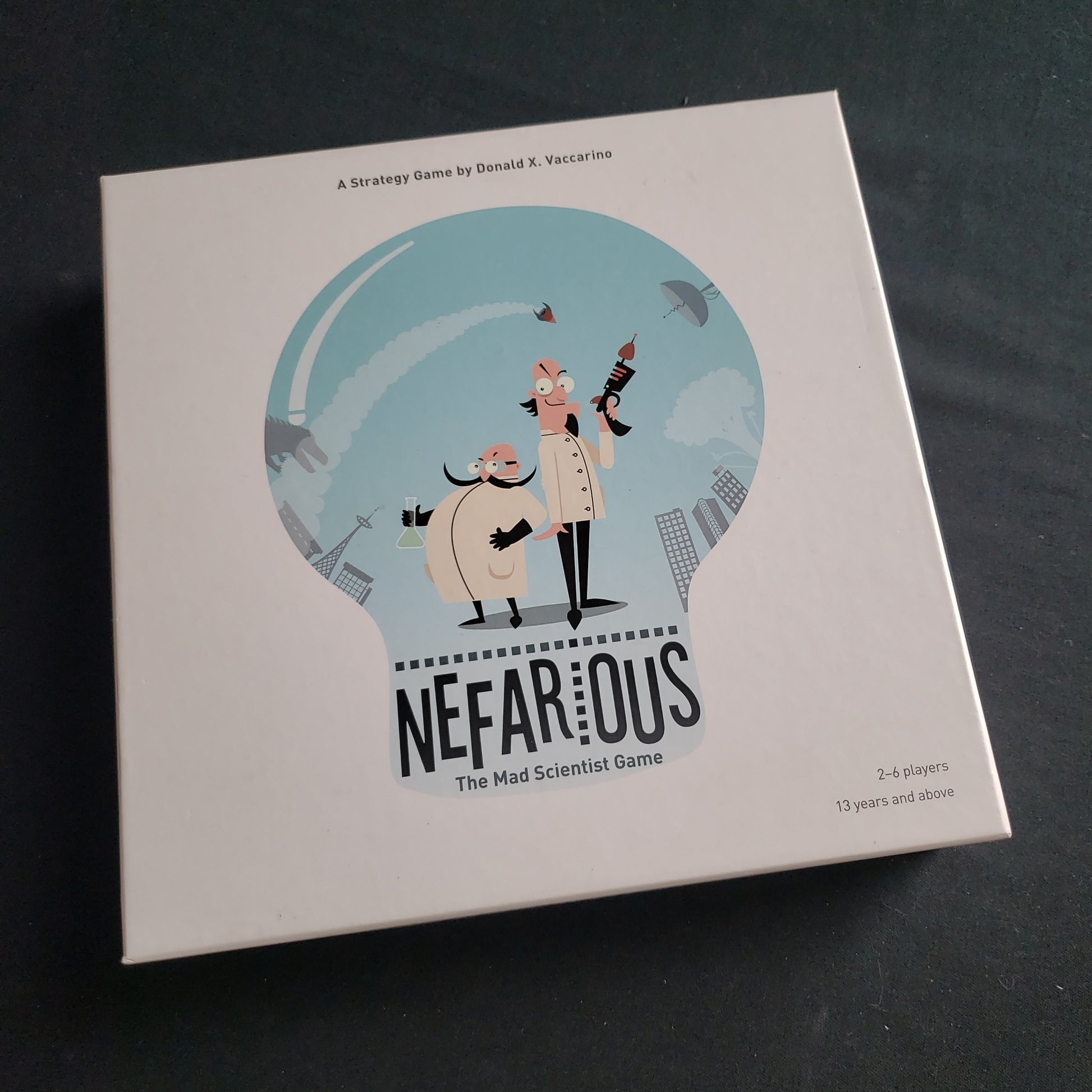 Image shows the front cover of the box of the Nefarious board game