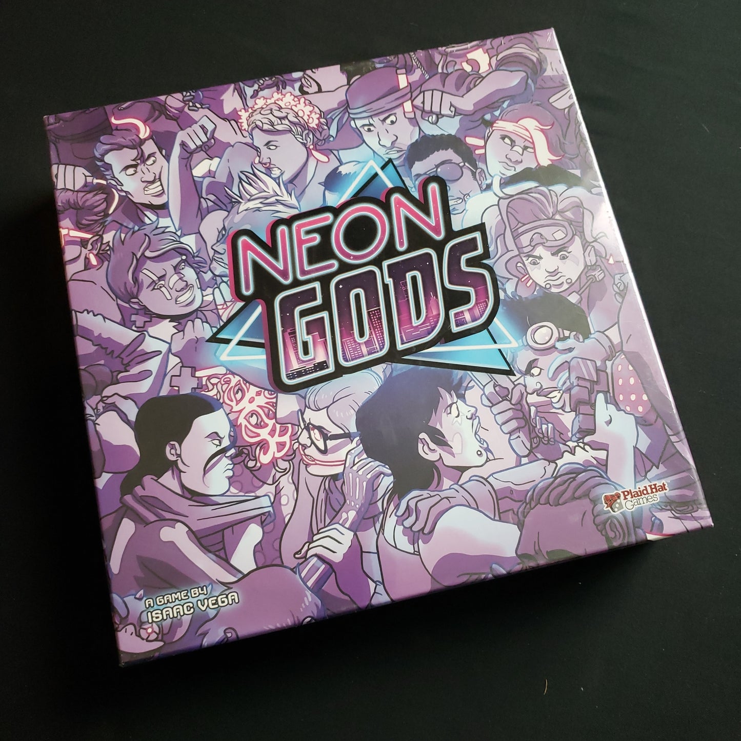 Image shows the front cover of the box of the Neon Gods board game